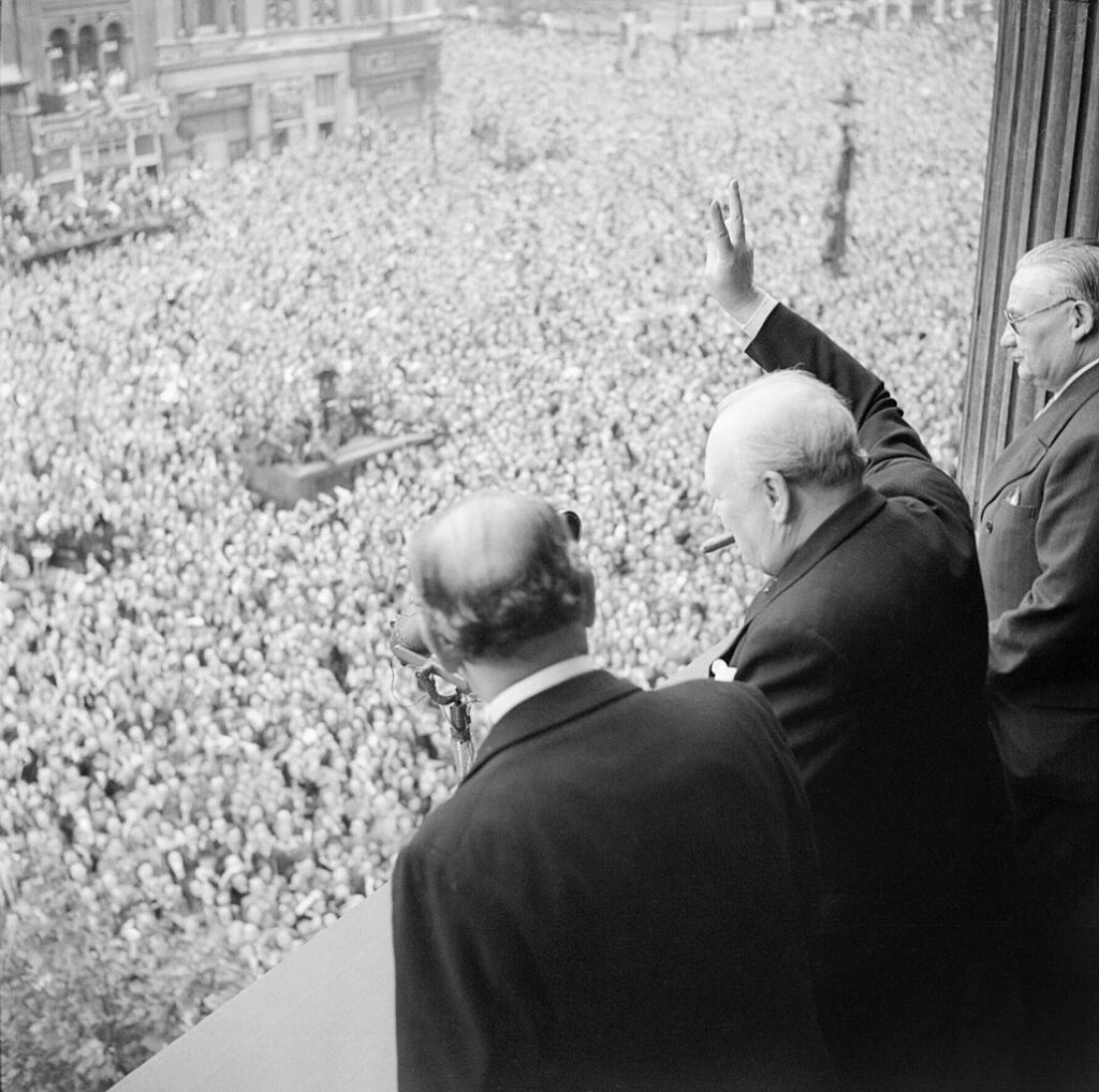 Winston Churchill and King George VI during the June 1940 victory parade in London, marking a significant moment in history.