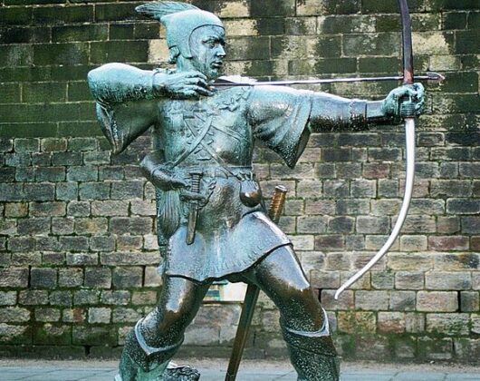 A statue depicting Robin Hood poised with a bow and arrow