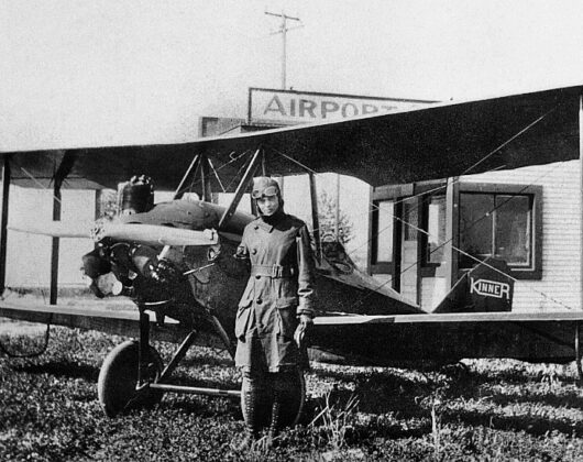 Amelia Earhart with her kinner airster