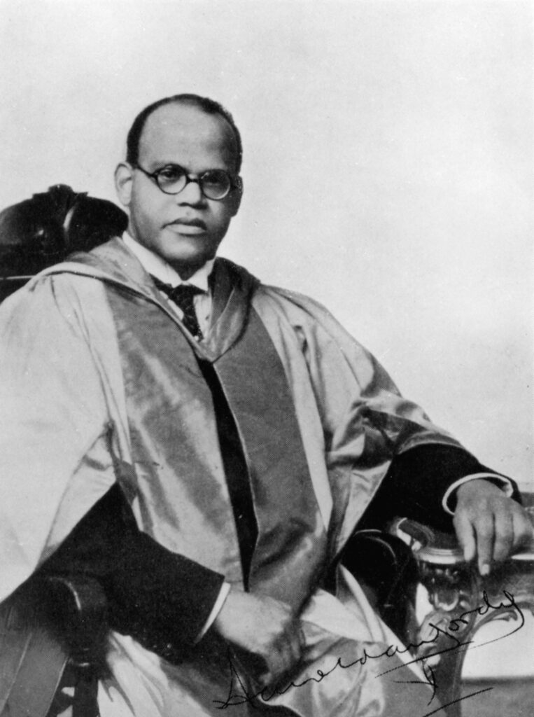 A black and white image of Dr. Harold Moody in a robe and gown, reflecting his distinguished character.