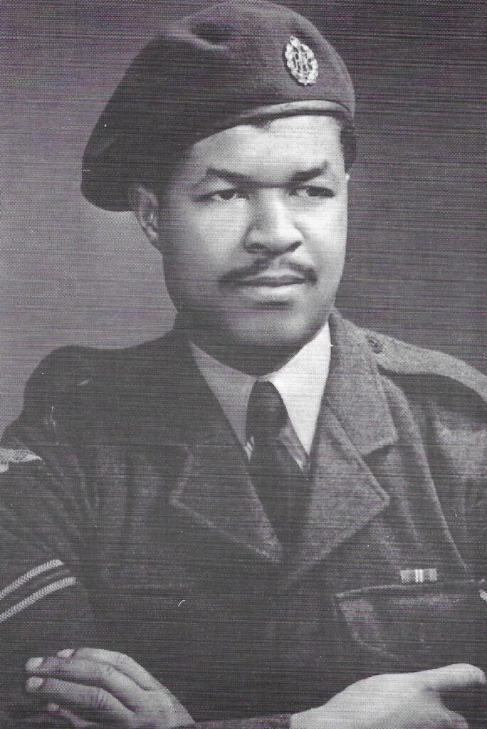 Black and white portrait of Sam King in uniform, exuding a sense of authority and pride.