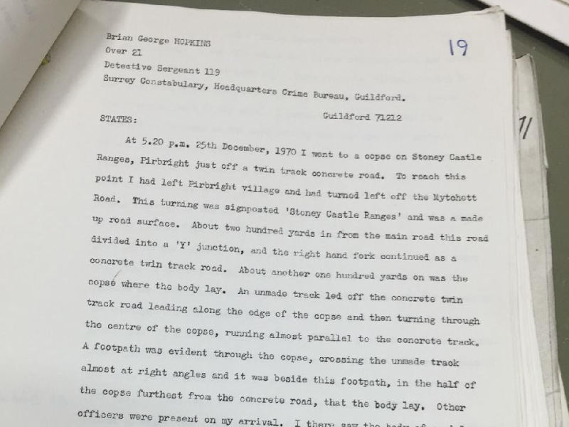 Close-up view of the poilce statement about Janet Stevens murder, displaying text and illustrations, highlighting the details of the printed content.